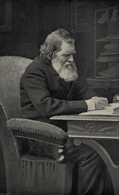 John Ruskin (1819-1900) in his study by English School